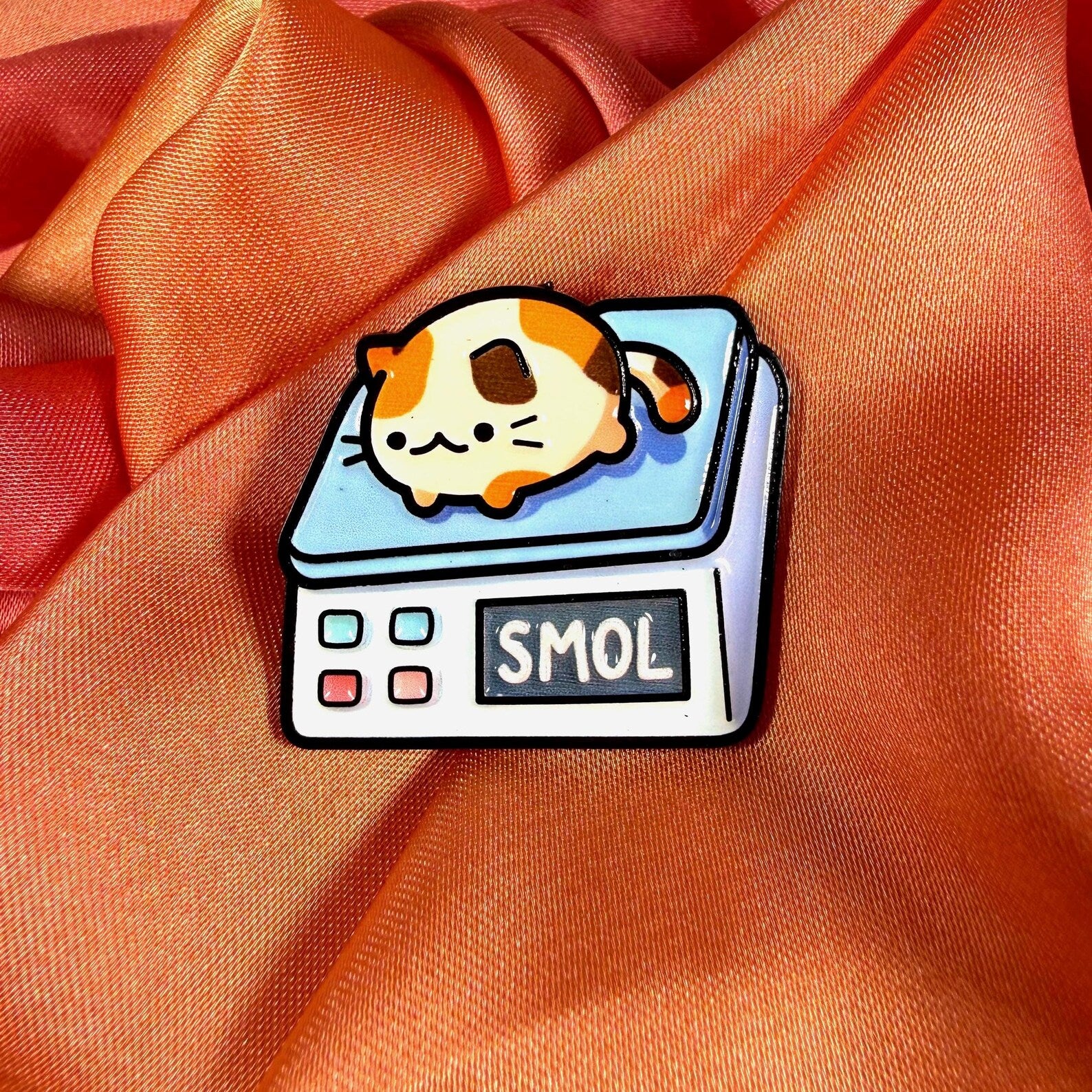 Smol Cat on Scales Enamel Pin Badge | Pincredible