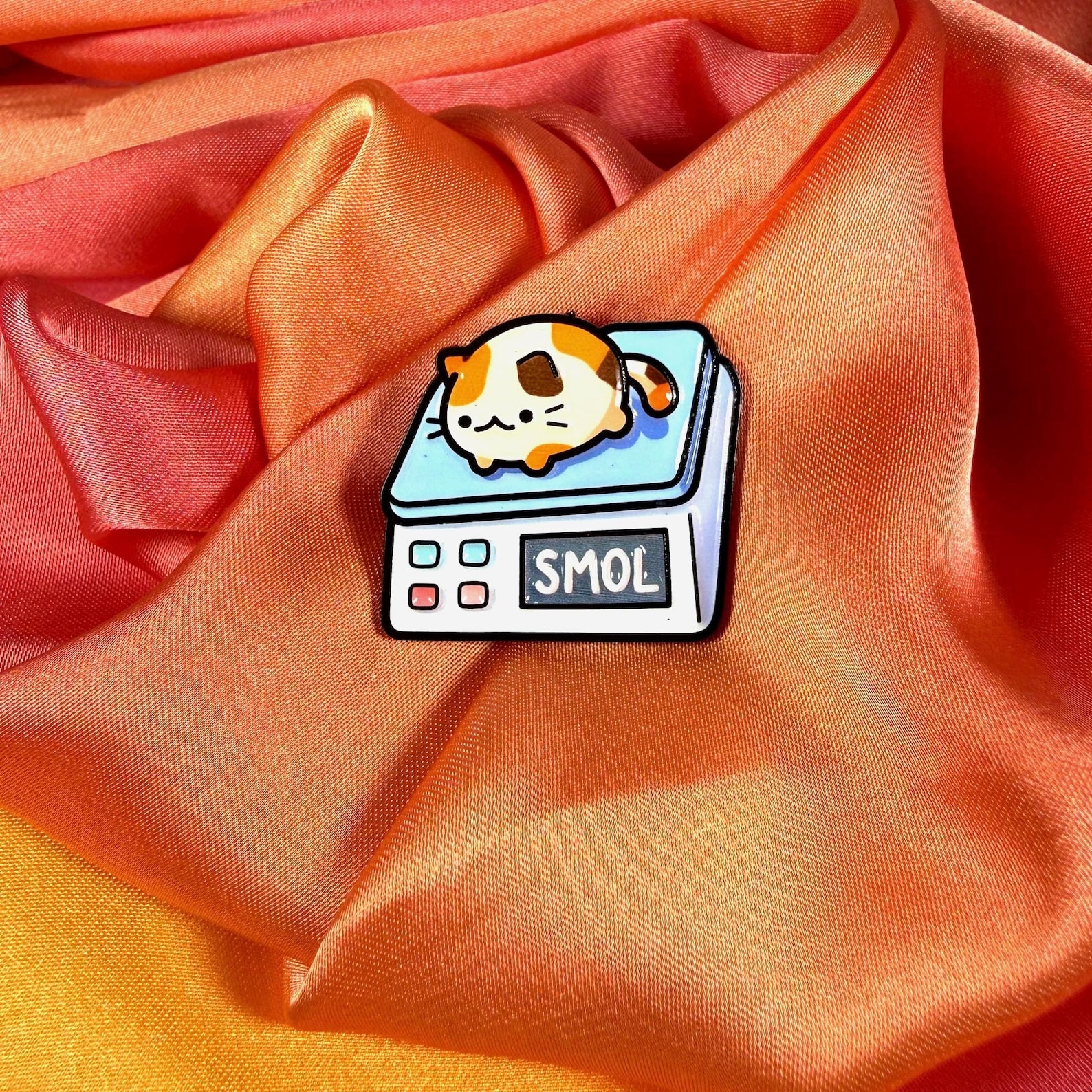 Smol Cat on Scales Enamel Pin Badge | Pincredible